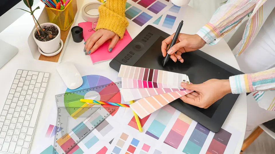 Designers collaborating on a design brief in a studio