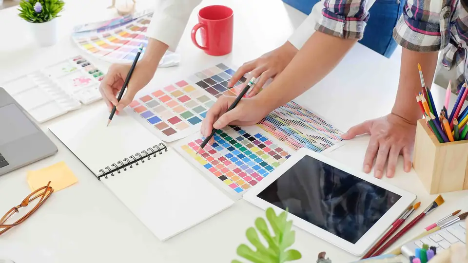 Creative team reviewing design work in a meeting