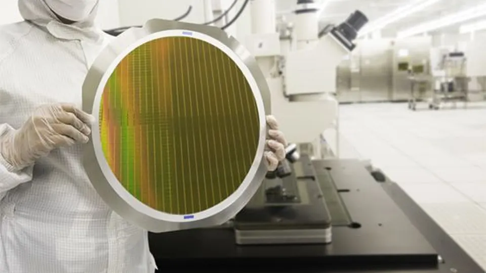 Engineer inspecting a silicon wafer