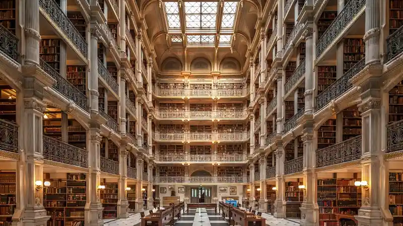A grand university library hall, the kind of setting Web of Science Research Intelligence is built to serve with AI-native analysis