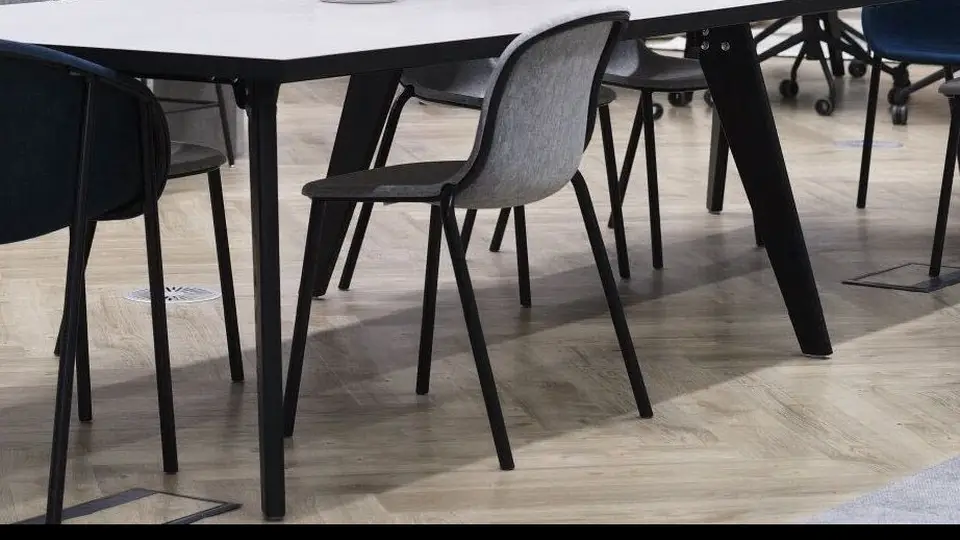 Cohere office workspace with meeting tables.