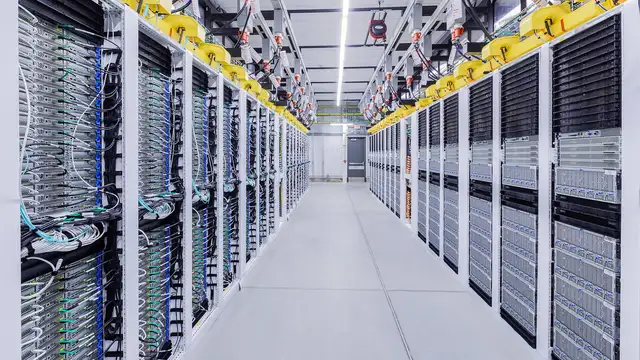 Rows of server racks in a modern data center, the infrastructure behind enterprise AI