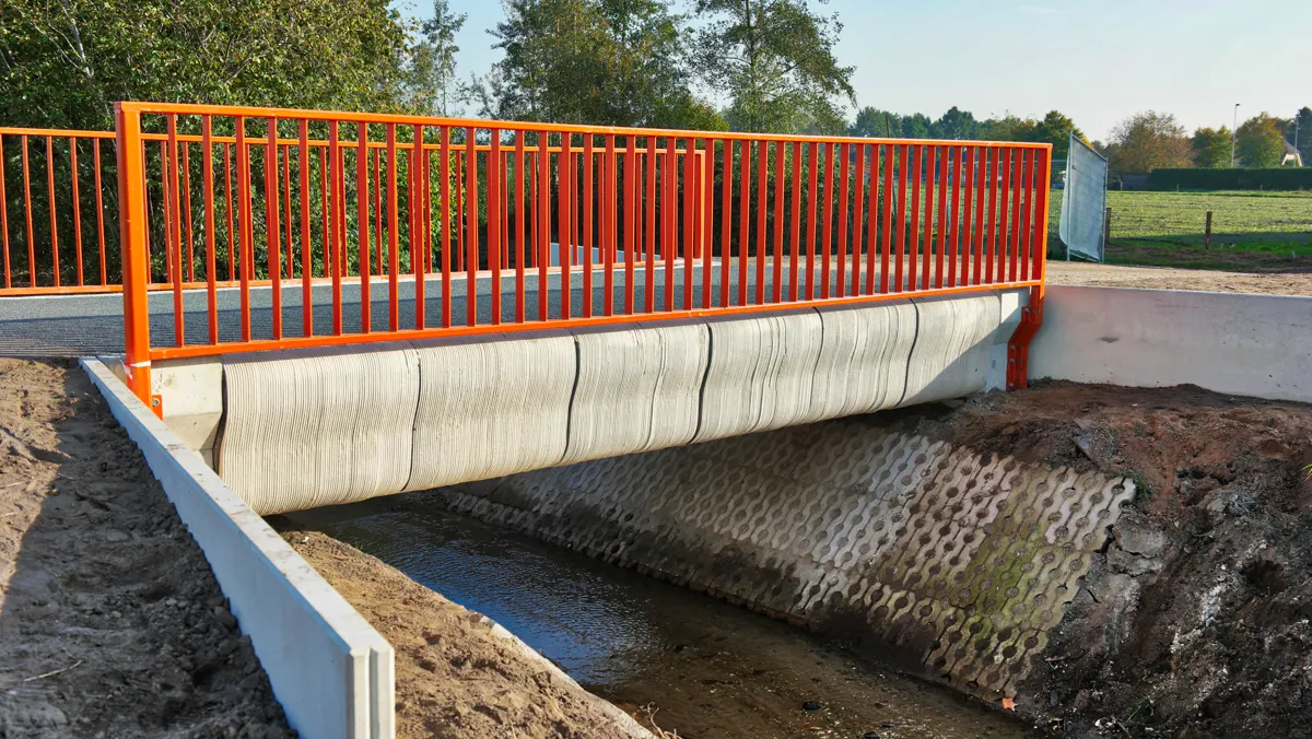 A 3D-printed concrete bicycle bridge in Gemert, Netherlands, showing the layered texture of printed construction