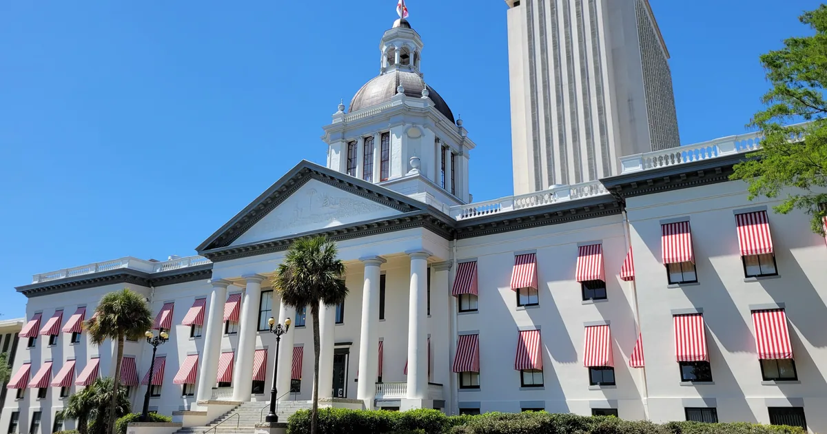 Florida's Historic Capitol in Tallahassee, with the modern capitol tower behind it — the state whose attorney general is asking a court to halt OpenAI's model training.