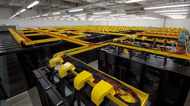 A supercomputer installation with rows of computing cabinets