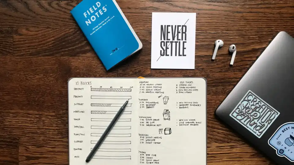 Planning the job hunt at a desk with a laptop and notebook