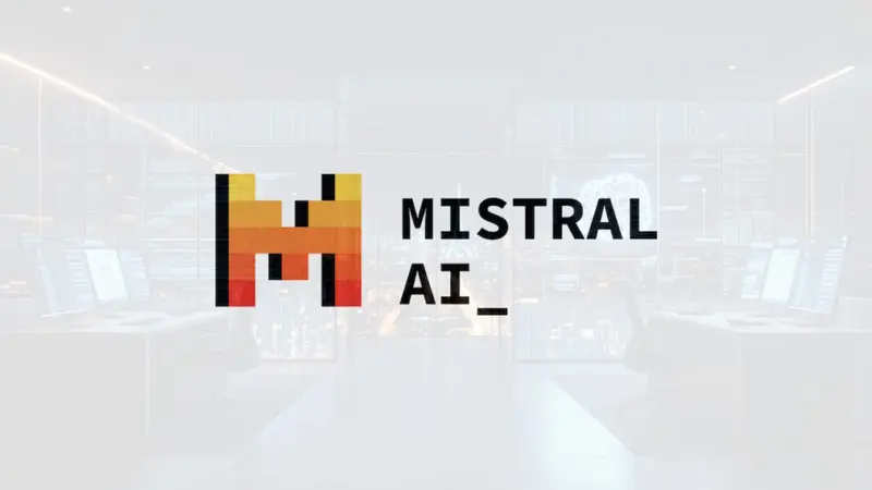 The Mistral AI logo over a bright modern office, representing the Paris lab's new flagship open-weight model.