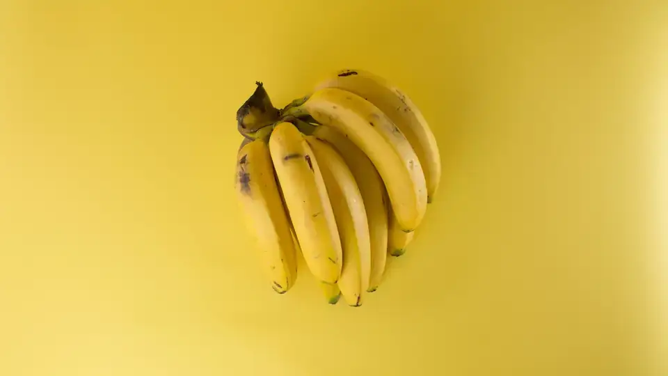 Close-up of yellow bananas, tightly cropped.