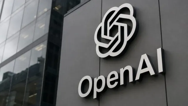 The OpenAI logo on a dark building facade.