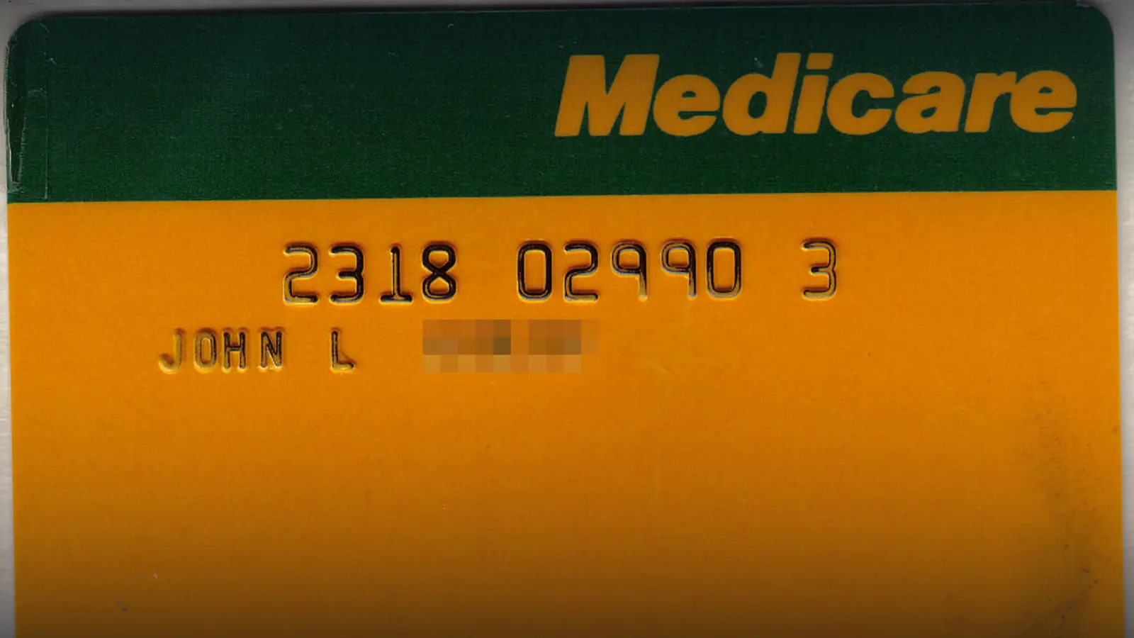 An anonymized Australian Medicare card with the green-and-gold Medicare branding
