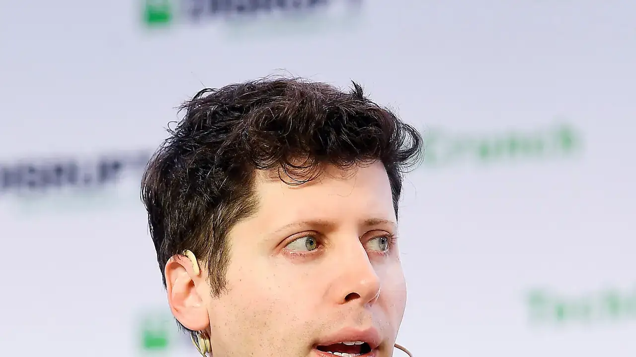 OpenAI CEO Sam Altman speaking on stage at TechCrunch Disrupt