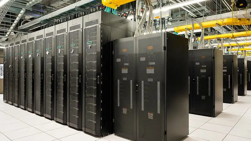 Rows of server racks inside a large data center hall