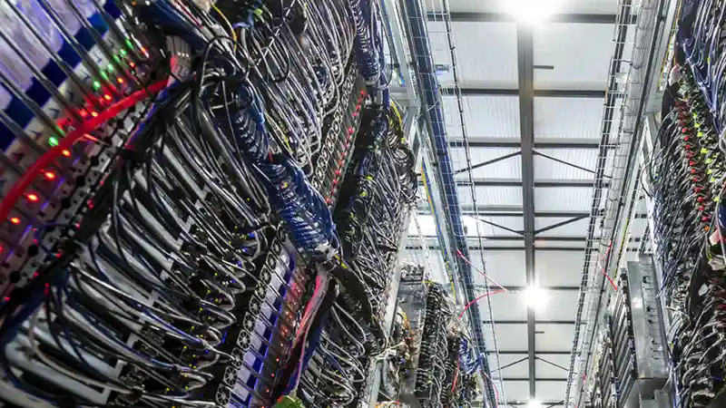 Rows of server racks inside an OVHcloud datacenter in Roubaix, France
