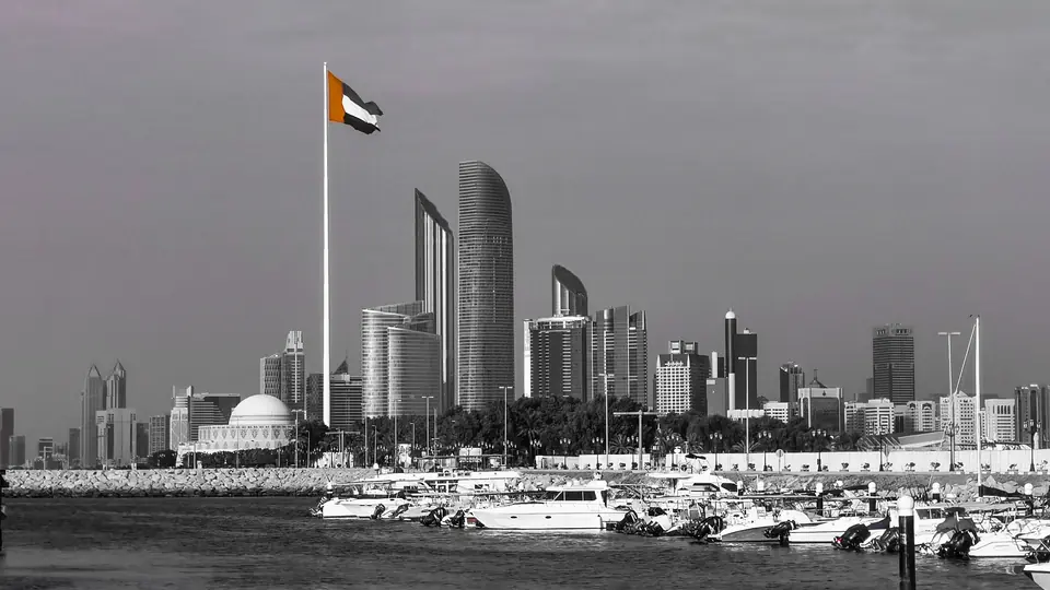 The Abu Dhabi skyline with the UAE flag flying.