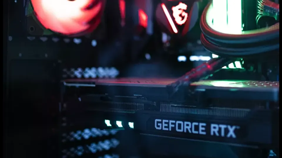 Red-lit case fans and a GPU shroud inside a gaming PC &mdash; PolyStrata keeps every request on this machine