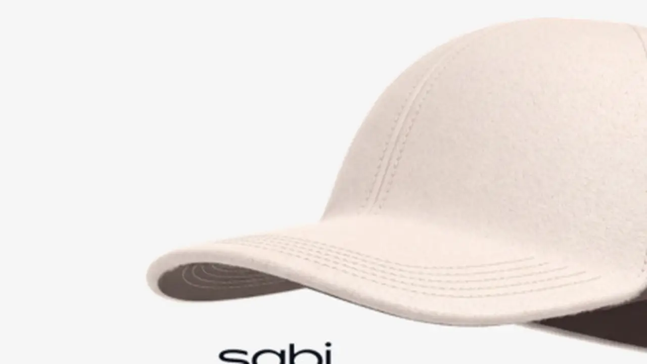 Close-up of the Sabi cap's fabric panels and stitching, with EEG sensors hidden inside the headwear.