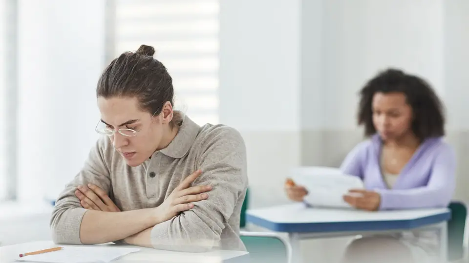 Two students reviewing assessment papers