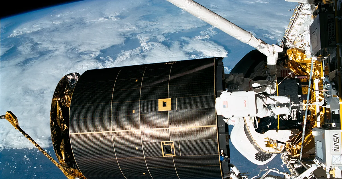 The Intelsat VI communications satellite grappled by the STS-49 crew above the space shuttle Endeavour's payload bay