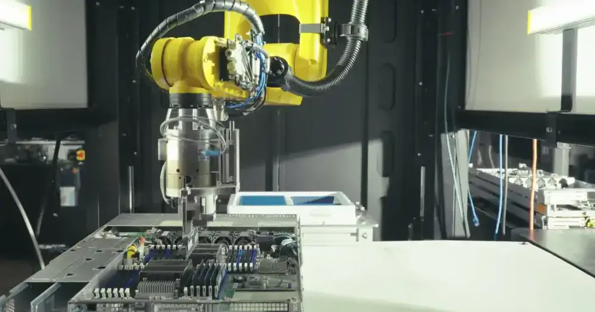 Robotic arms assembling electronics on an automated factory line at a Bright Machines microfactory.