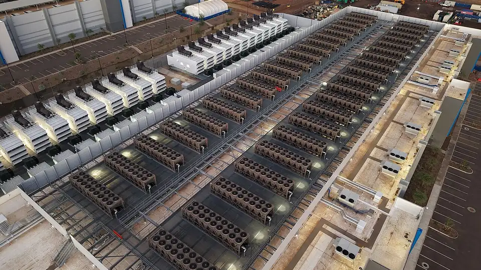 Aerial view of a large data center with rooftop cooling units