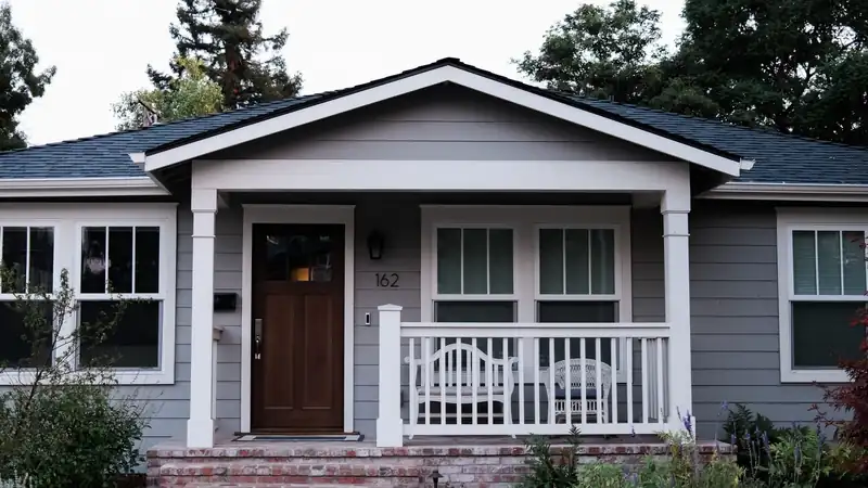 A suburban home at dusk, representing the U.S. mortgages ValonOS services.