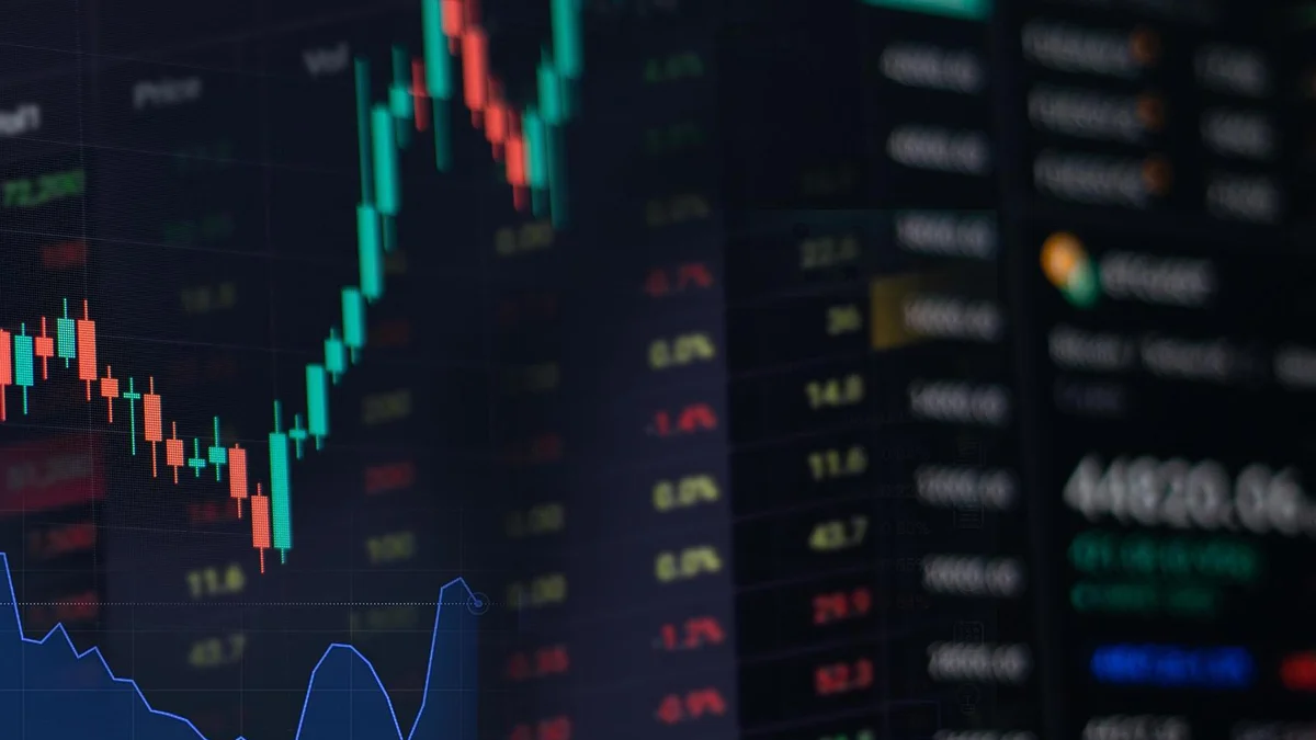 Stock market charts displayed on a screen