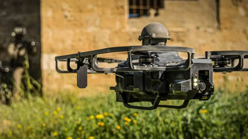An XTEND tactical quadcopter drone photographed close-up in the field.